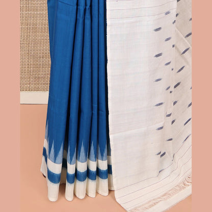 Pothys Blue Plain Ikkat Cotton Saree, Complemented by a Contrast Ikkat Temple Border, Pallu Steeped with Buttas, and Paired with a Contrast Blouse