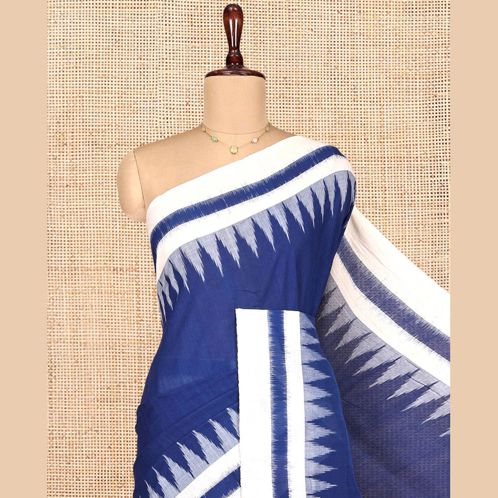 Pothys Navy Blue Blue Plain Ikkat Cotton Saree, Complemented by a Contrast Ikkat Temple Border, Pallu Steeped with Buttas, and Paired with a Contrast Blouse