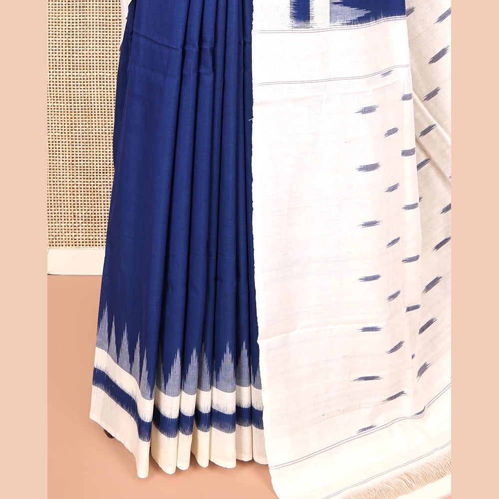 Pothys Navy Blue Blue Plain Ikkat Cotton Saree, Complemented by a Contrast Ikkat Temple Border, Pallu Steeped with Buttas, and Paired with a Contrast Blouse