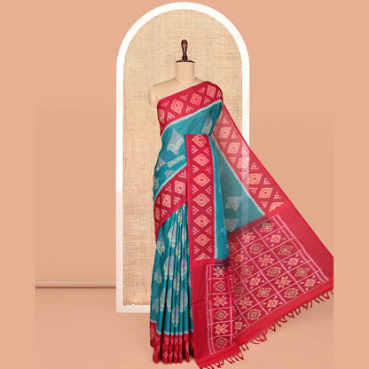 Pothys Blue Ikkat Cotton Saree, Decorated with Ikkat-style Buttas All Over Its Body, Complemented by a Contrast Ikkat-Textured Border, Pallu of Butta Enclosed Checks, and Paired with a Contrast Blouse