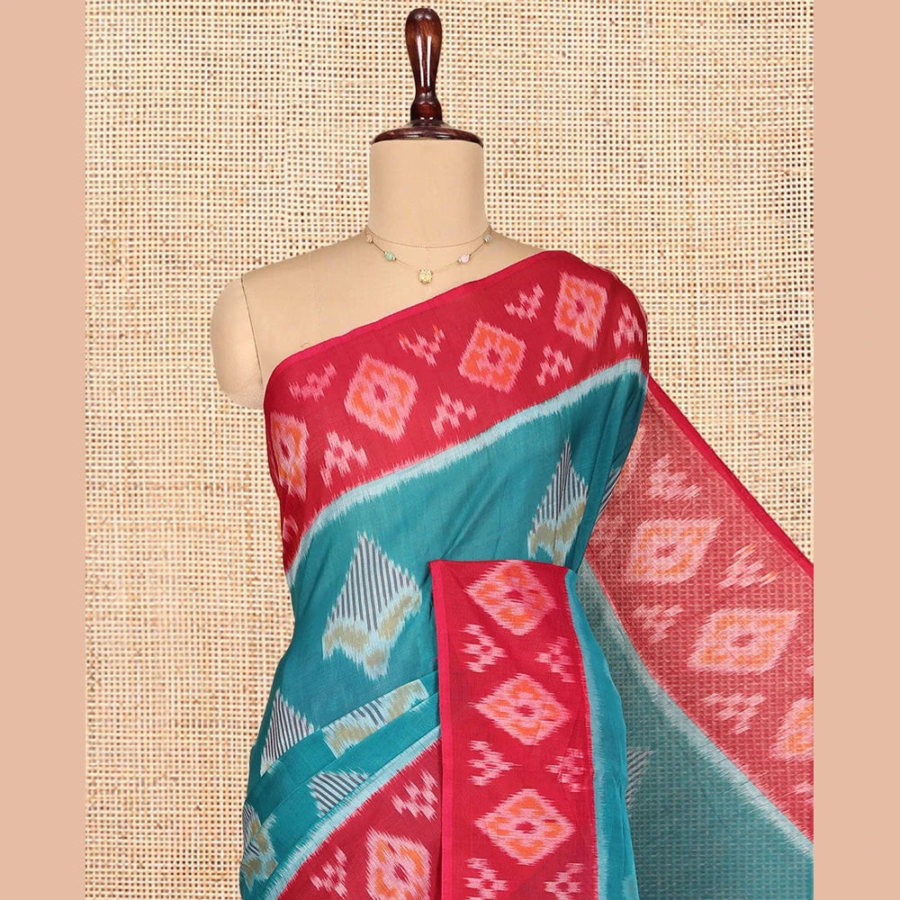 Pothys Blue Ikkat Cotton Saree, Decorated with Ikkat-style Buttas All Over Its Body, Complemented by a Contrast Ikkat-Textured Border, Pallu of Butta Enclosed Checks, and Paired with a Contrast Blouse