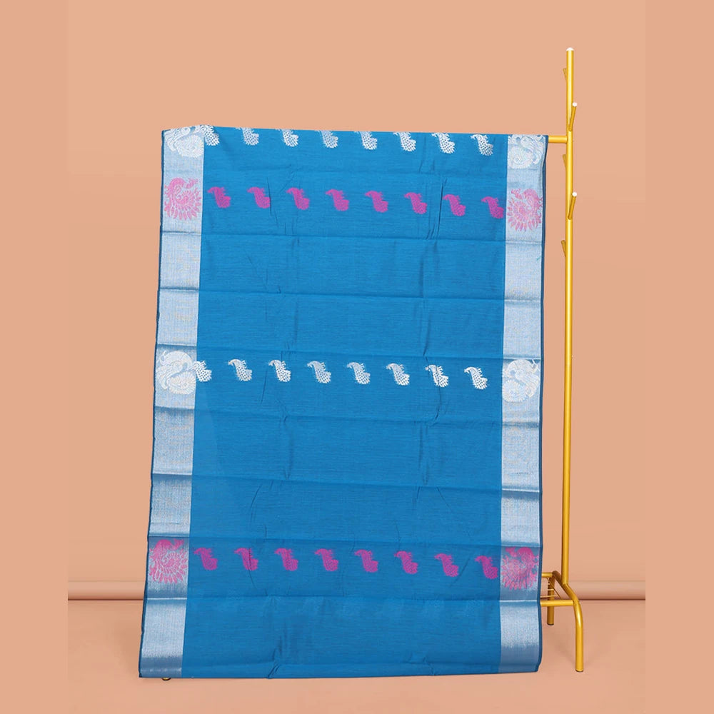 Pothys Blue Semi-Silk Cotton Saree, Adorned with Peacock Buttas All Over Its Body, Highlighted by a Self-Border of Peacocks, Pallu Steeped with Peacock Designs, and Paired with a Matching Blouse