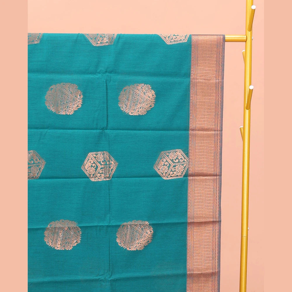 Pothys Rama Blue Semi-Silk Cotton Saree, Spotlighted with Zari Buttas All Over Its Body, Highlighted by a Traditional Zari Border, Pallu of Paisley Designs, and Paired with a Matching Blouse