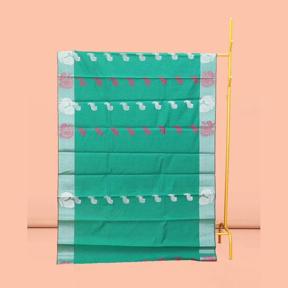 Pothys Green Semi-Silk Cotton Saree, Styled with Peacock Buttas All Over Its Body, Highlighted by a Self-Border of Peacock Designs, Pallu Steeped with Peacock Zari Design, and Paired with a Matching Blouse