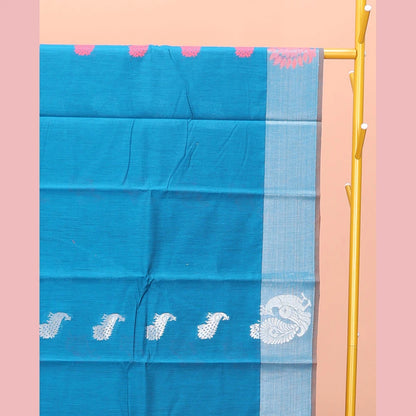 Pothys Blue Semi-Silk Cotton Saree, Graced with Peacock Buttas All Over Its Body, a Self-Border of Peacock Designs, Pallu Steeped with Peacock Zari Design, and Paired with a Matching Blouse