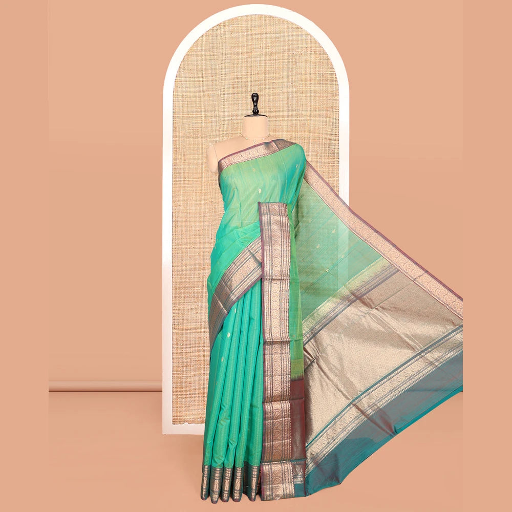Pothys Sea Green Silk Cotton Saree, Elevated with Buttas, Complemented by Contrast Traditional Paisley Zari Design Border, Zari-Decked Pallu, and a Contrast Blouse
