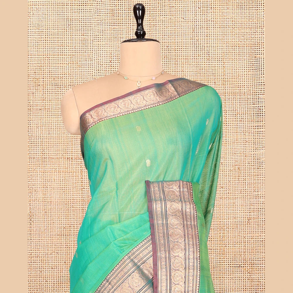 Pothys Sea Green Silk Cotton Saree, Elevated with Buttas, Complemented by Contrast Traditional Paisley Zari Design Border, Zari-Decked Pallu, and a Contrast Blouse