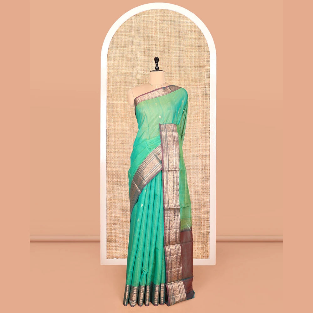 Pothys Sea Green Silk Cotton Saree, Elevated with Buttas, Complemented by Contrast Traditional Paisley Zari Design Border, Zari-Decked Pallu, and a Contrast Blouse