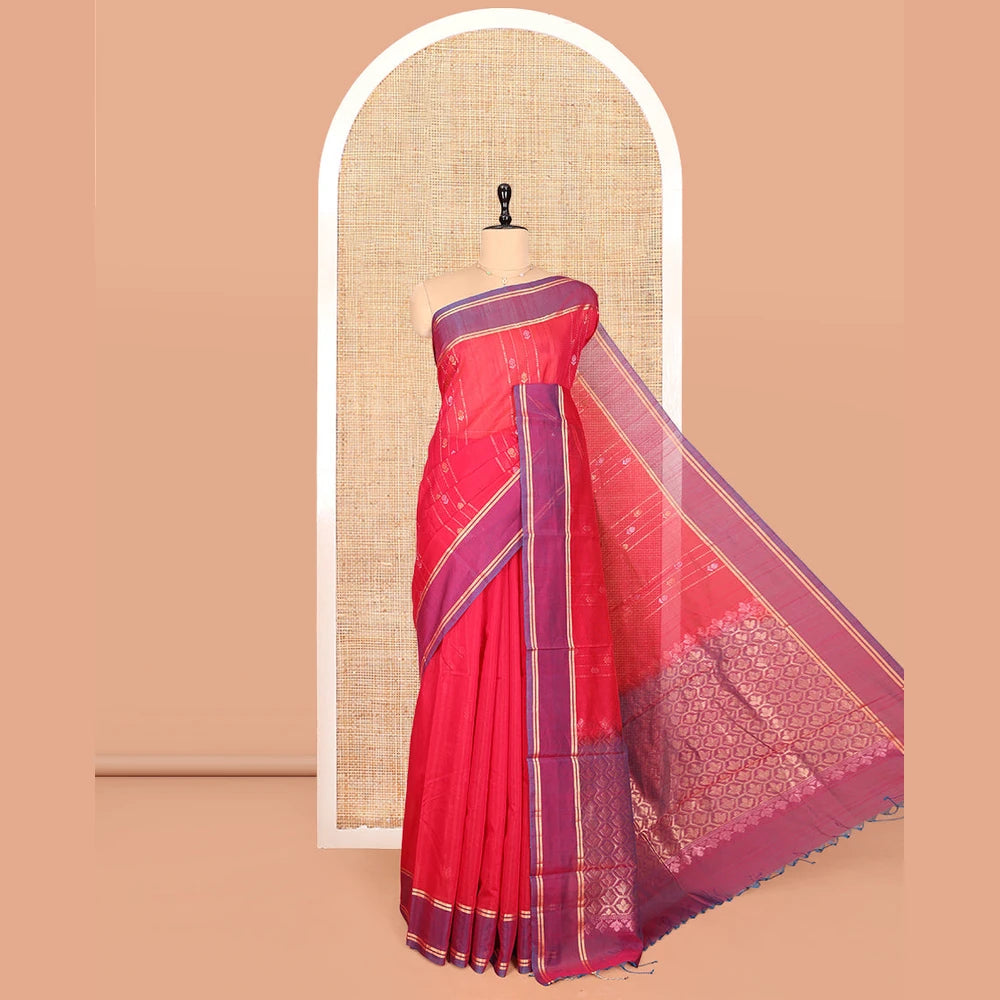 Pothys Red Silk Cotton Saree, Decorated with Zari Stripes and Buttas, Complemented by a Contrast Border, Contrast Butta Enclosed Hexagon Pallu, and a Contrast Blouse