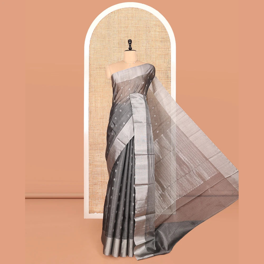 Pothys Grey Silk Cotton Saree, Gleamed up with Buttas, a Subtle Bavanji Border, Grand Geometric Patterned Pallu, and a Matching Blouse