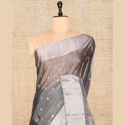 Pothys Grey Silk Cotton Saree, Gleamed up with Buttas, a Subtle Bavanji Border, Grand Geometric Patterned Pallu, and a Matching Blouse