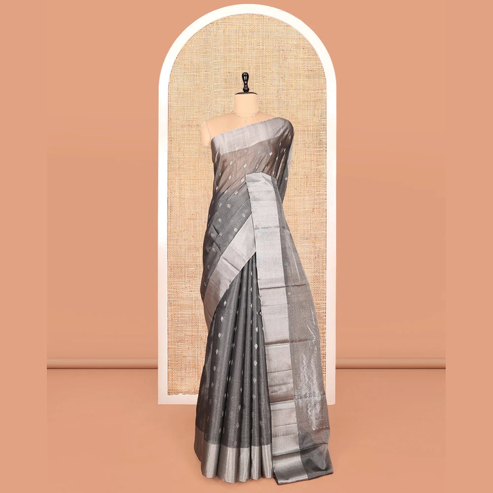 Pothys Grey Silk Cotton Saree, Gleamed up with Buttas, a Subtle Bavanji Border, Grand Geometric Patterned Pallu, and a Matching Blouse