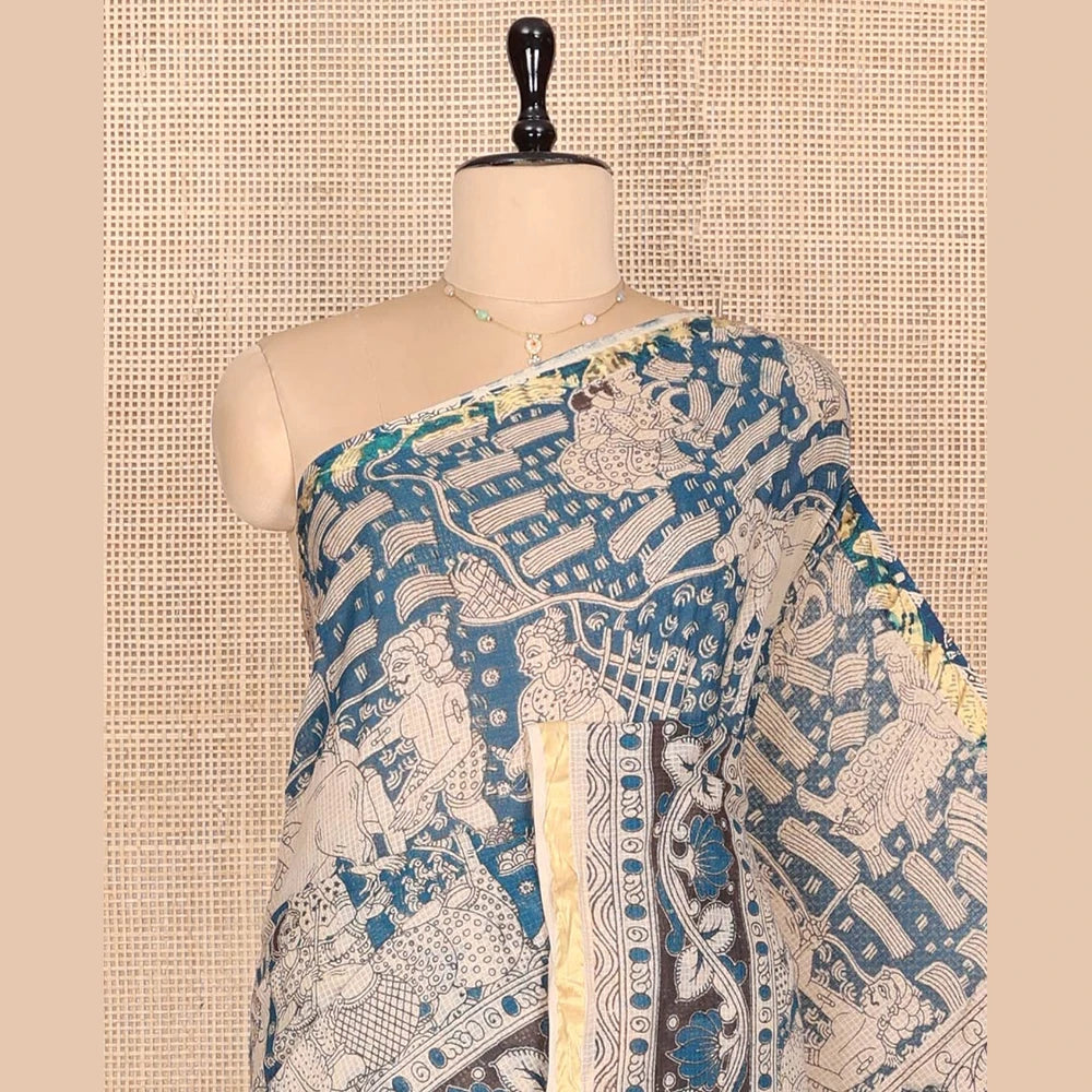 Pothys Blue Machine-Printed Kalamkari Cotton Saree Features Human Motifs, a Piping Border, Pallu of Peacocks, and a Matching Blouse