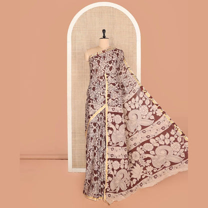 Pothys Brown Machine-Printed Kalamkari Cotton Saree Features Human Motifs, a Piping Border, Pallu of Peacocks, and a Matching Blouse