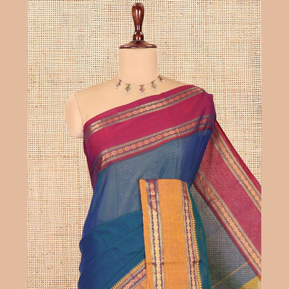 Pothys Blue Plain Mercerised Cotton Saree, Contrast Ganga-Jamuna Temple Rudraksha Border, Striped Pallu, and a Matching Blouse
