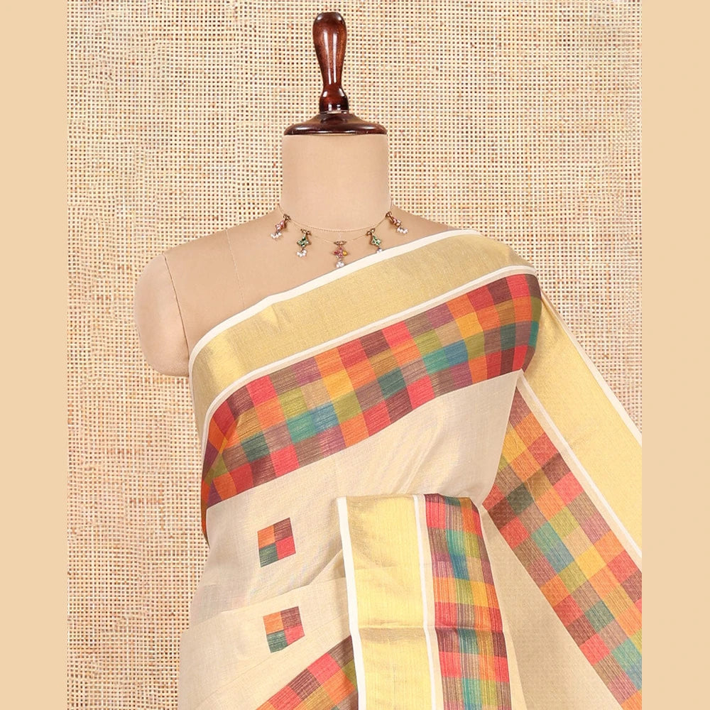 Pothys Gold-Purple Kerala Tissue Cotton Saree Features Madras Checked Buttas, a Zari Checked Border, and a Contrast Blouse