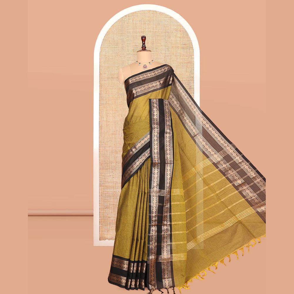 Pothys Green Plain Chettinad Cotton Saree, Complemented by a Contrast Rettai Pettu Rudraksham Zari Border, Striped Pallu, and a Matching Blouse