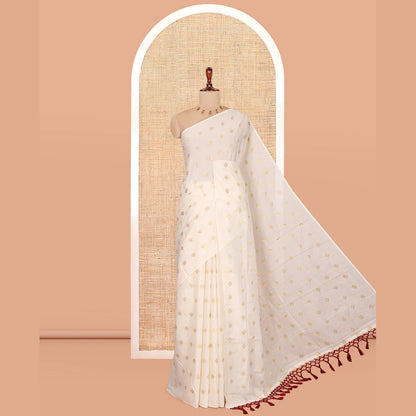 Pothys Borderless Cream Kerala Cotton Saree, Adorned with Zari Buttas, a Self-Pallu, and a Matching Blouse