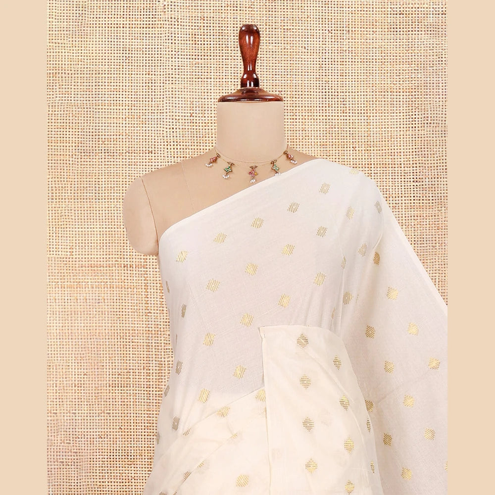Pothys Borderless Cream Kerala Cotton Saree, Adorned with Zari Buttas, a Self-Pallu, and a Matching Blouse