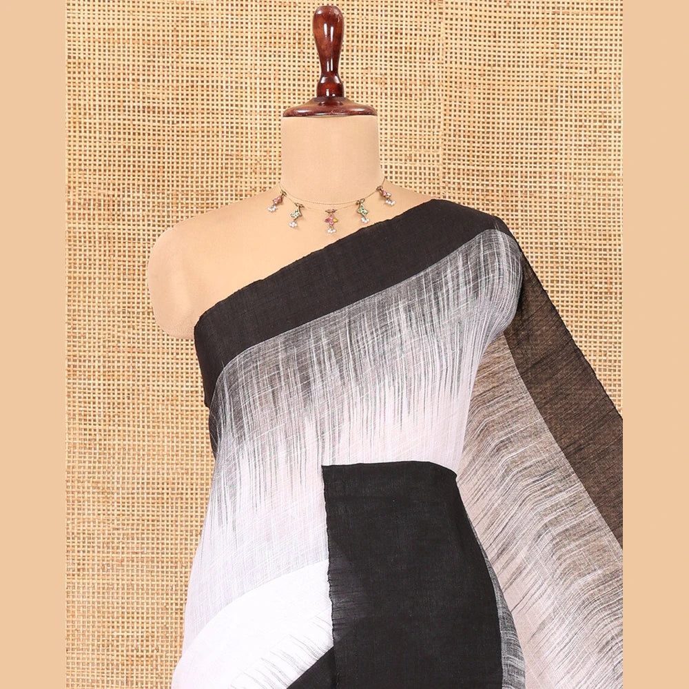 Pothys White Ikkat Weave Khadi Linen Saree, Complemented by a Contrast Border, and a Contrast Blouse