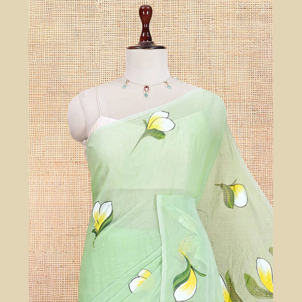 Pothys Borderless Pista Green Khadi Mul Cotton Saree Features Floral Hand-Brush Painting, and a Matching Blouse