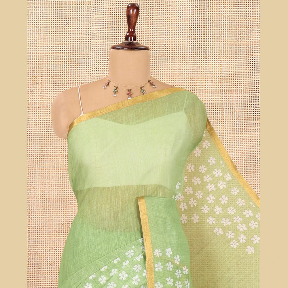 Pothys Green Linen Cotton Saree Features Half-And-Half-Style Flower Motifs Print, a Piping Border, and a Matching Blouse