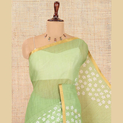 Pothys Green Linen Cotton Saree Features Half-And-Half-Style Flower Motifs Print, a Piping Border, and a Matching Blouse