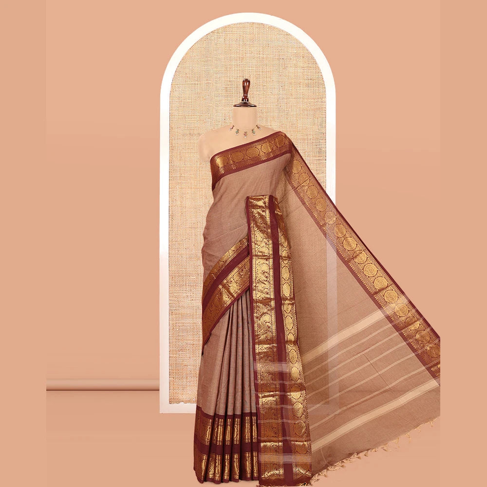 Pothys Brown Plain Chettinad Cotton Saree, Complemented by a Contrast Peacock-Chakram Rettai Pettu Border, and a Matching Blouse