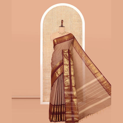 Pothys Brown Plain Chettinad Cotton Saree, Complemented by a Contrast Peacock-Chakram Rettai Pettu Border, and a Matching Blouse