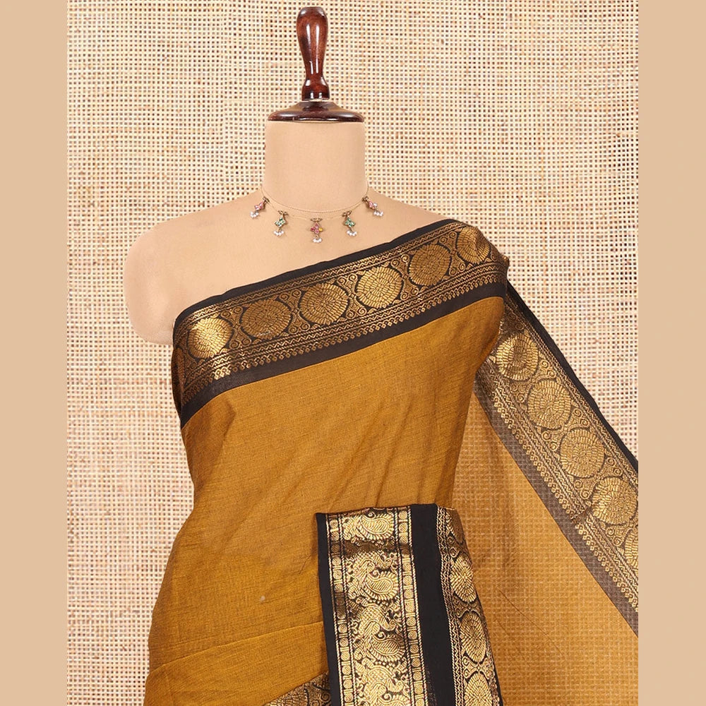 Pothys Mustard Plain Chettinad Cotton Saree, Complemented by a Contrast Peacock-Chakram Rettai Pettu Border, and a Matching Blouse