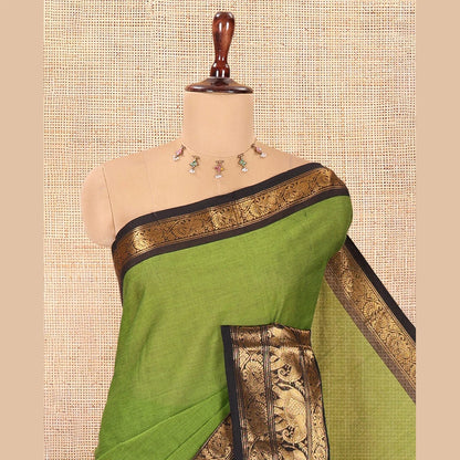 Pothys Green Plain Chettinad Cotton Saree, a Contrast Temple Elephant-Peacock Zari Border, Striped Pallu, and a Matching Blouse