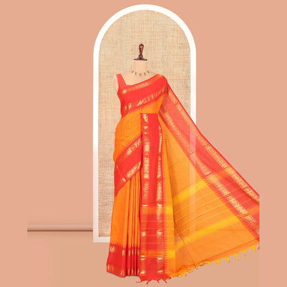 Pothys Orange Plain Chettinad Cotton Saree, a Contrast Rettai Pettu Peacock-Chakra Temple Border, Striped Pallu, a Matching Blouse