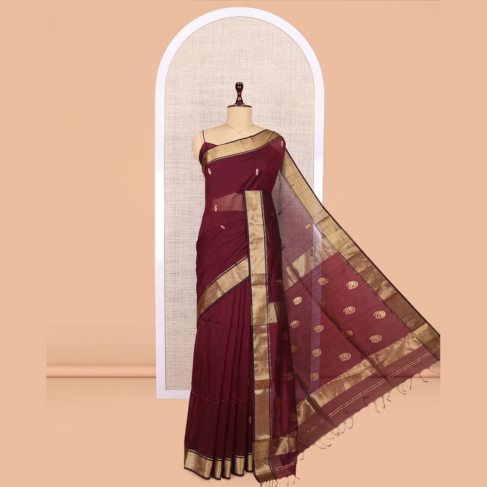Pothys Maroon Maheshwari Cotton Saree, Adorned with Buttas, Highlighted by a Traditional Zari Border, Pallu Gleamed Up with Zari Buttas, and a Matching Blouse