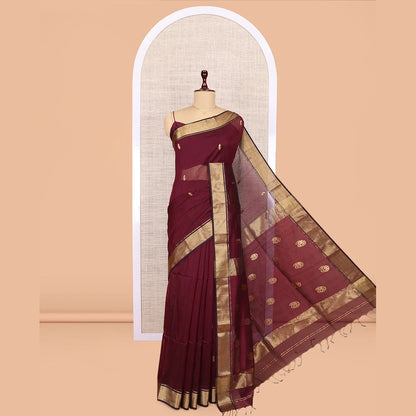 Pothys Maroon Maheshwari Cotton Saree, Adorned with Buttas, Highlighted by a Traditional Zari Border, Pallu Gleamed Up with Zari Buttas, and a Matching Blouse