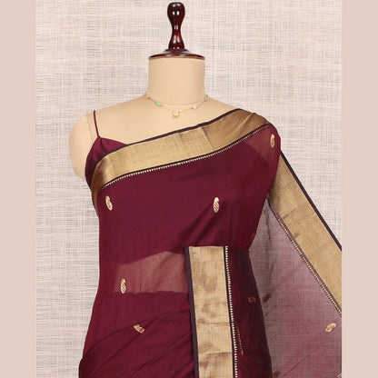Pothys Maroon Maheshwari Cotton Saree, Adorned with Buttas, Highlighted by a Traditional Zari Border, Pallu Gleamed Up with Zari Buttas, and a Matching Blouse