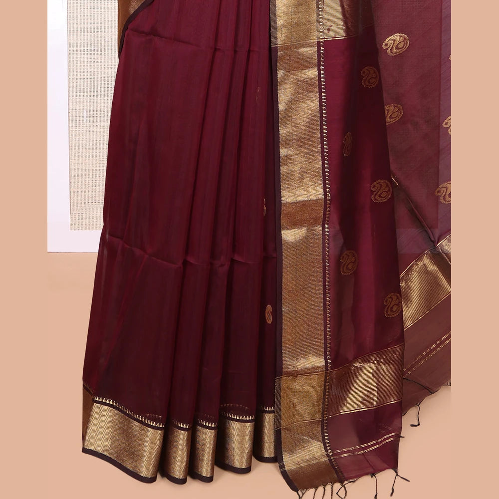 Pothys Maroon Maheshwari Cotton Saree, Adorned with Buttas, Highlighted by a Traditional Zari Border, Pallu Gleamed Up with Zari Buttas, and a Matching Blouse