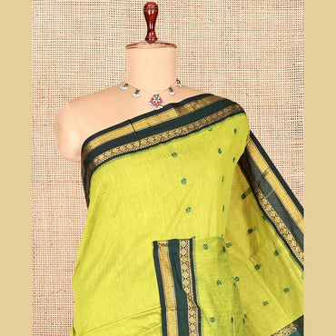 Pothys Leaf Green Kalyani Cotton Saree, Finely Crafted with Thread Buttas, a Contrast Traditional Rettai Pettu Zari Border, Grand Pallu, and a Contrast Blouse